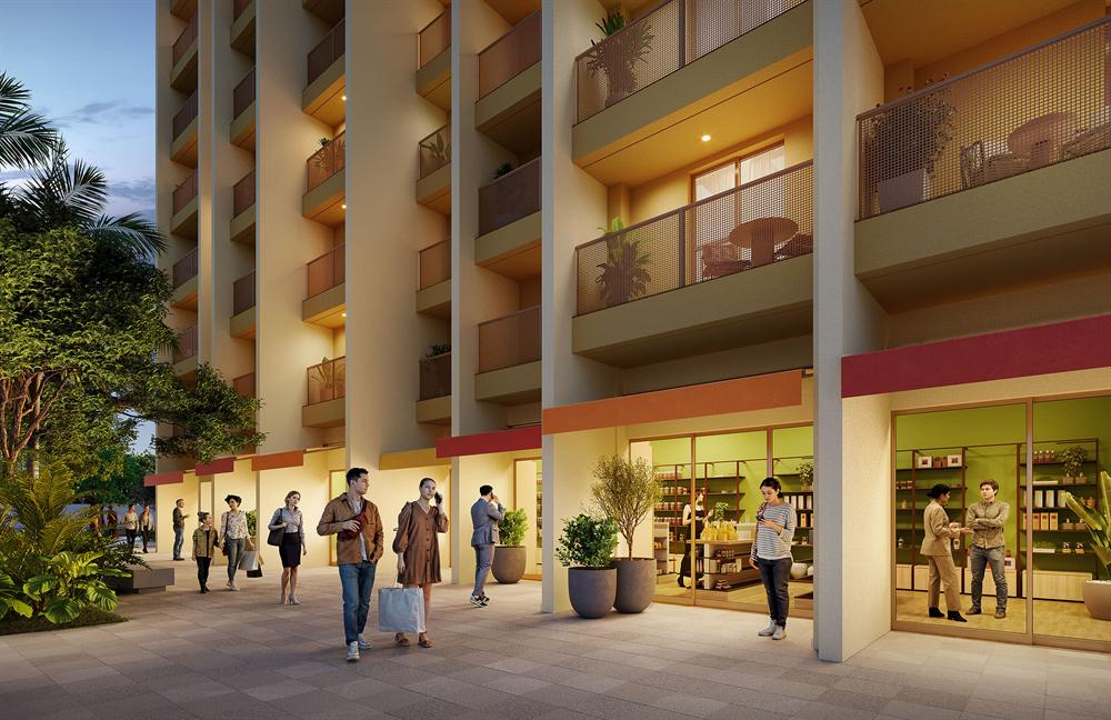 Térreo comercial do Residencial Erê com lojas iluminadas e calçada arborizada